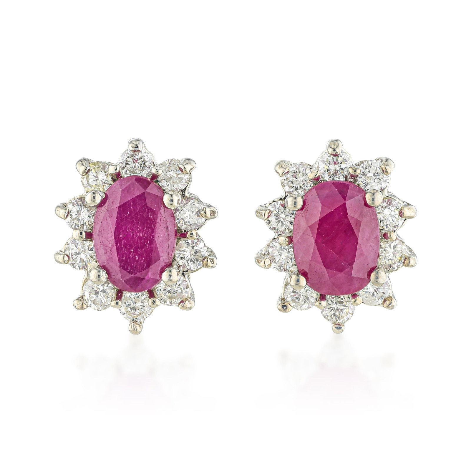 Ruby and Diamond Cluster Earrings: ESTIMATED RETAIL PRICE: $4,000* *This is the estimated value a piece of similar quality, craftsmanship, and characteristics could command at retail. The oval ruby cluster earring is one of the most ti