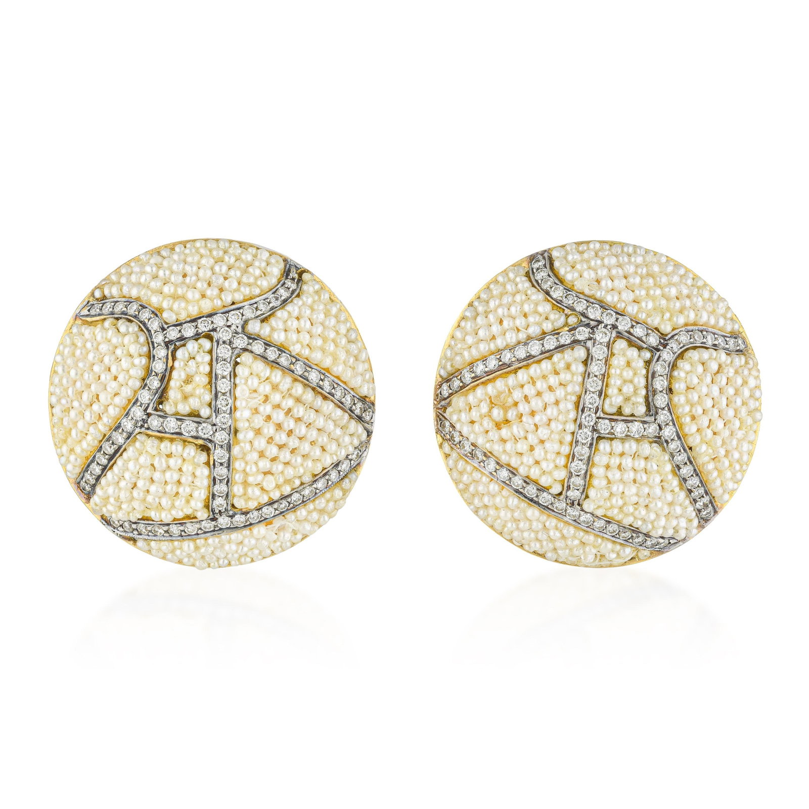 Seed Pearl and Diamond Earrings in Enameled Gold: ESTIMATED RETAIL PRICE: $7,500* *This is the estimated value a piece of similar quality, craftsmanship, and characteristics could command at retail. These magnificent button earrings showcase an
