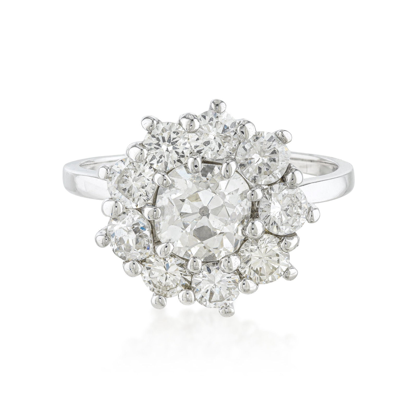 Old European Cut Diamond Cluster Ring: ESTIMATED RETAIL PRICE: 7,000* *This is the estimated value a piece of similar quality, craftsmanship, and characteristics could command at retail. Celebrating the romantic allure of antique diamond c