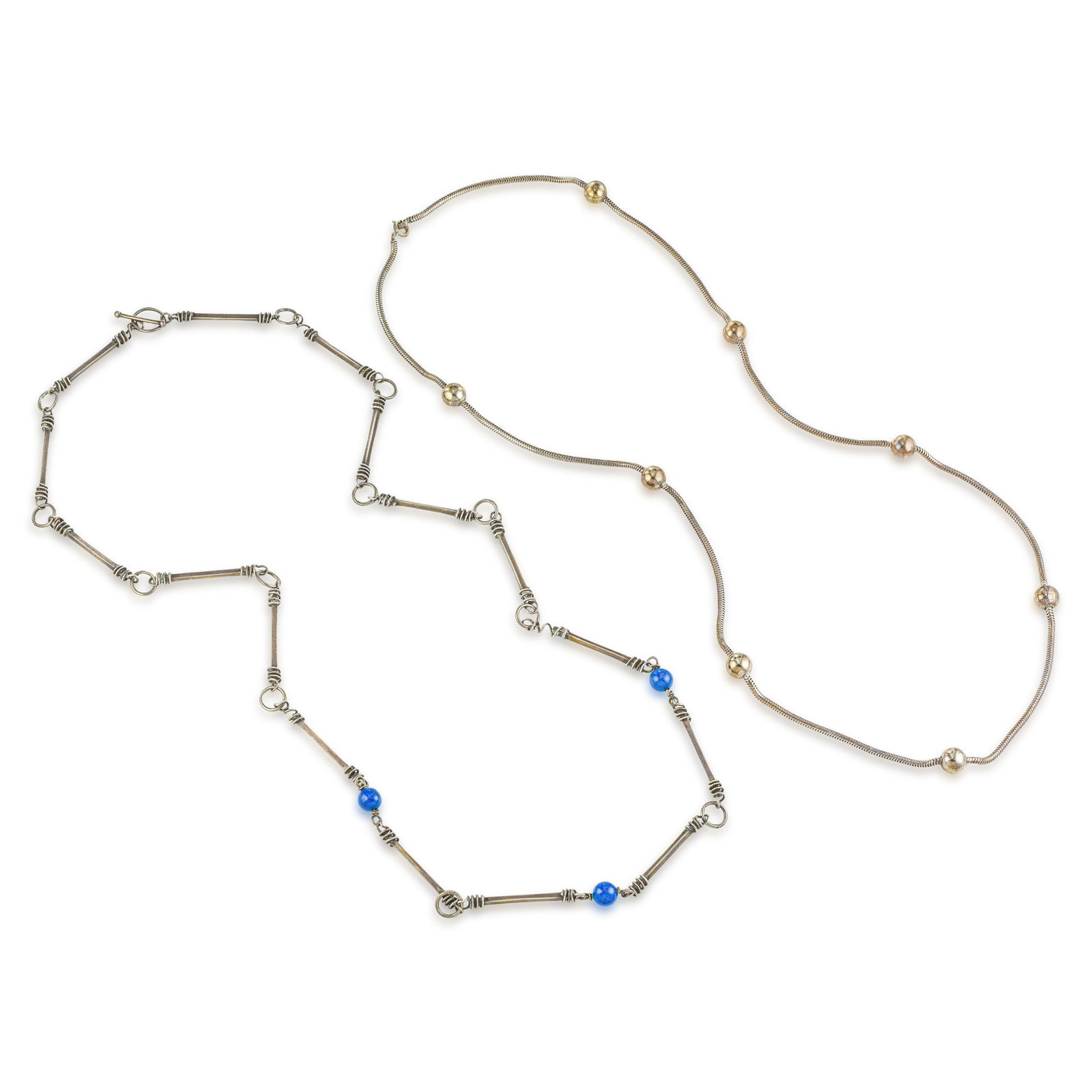 Set of Two Sterling Silver Chains: ESTIMATED RETAIL PRICE: 1,400* *This is the estimated value a piece of similar quality, craftsmanship, and characteristics could command at retail. This pairing of long sterling silver neck chains