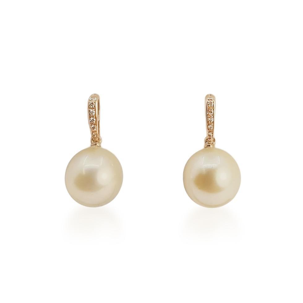 Golden South Sea Pearl and Diamond Drop Earrings: ESTIMATED RETAIL PRICE: $1,300* *This is the estimated value a piece of similar quality, craftsmanship, and characteristics could command at retail. Highlighting the warm, champagne-gold luster of
