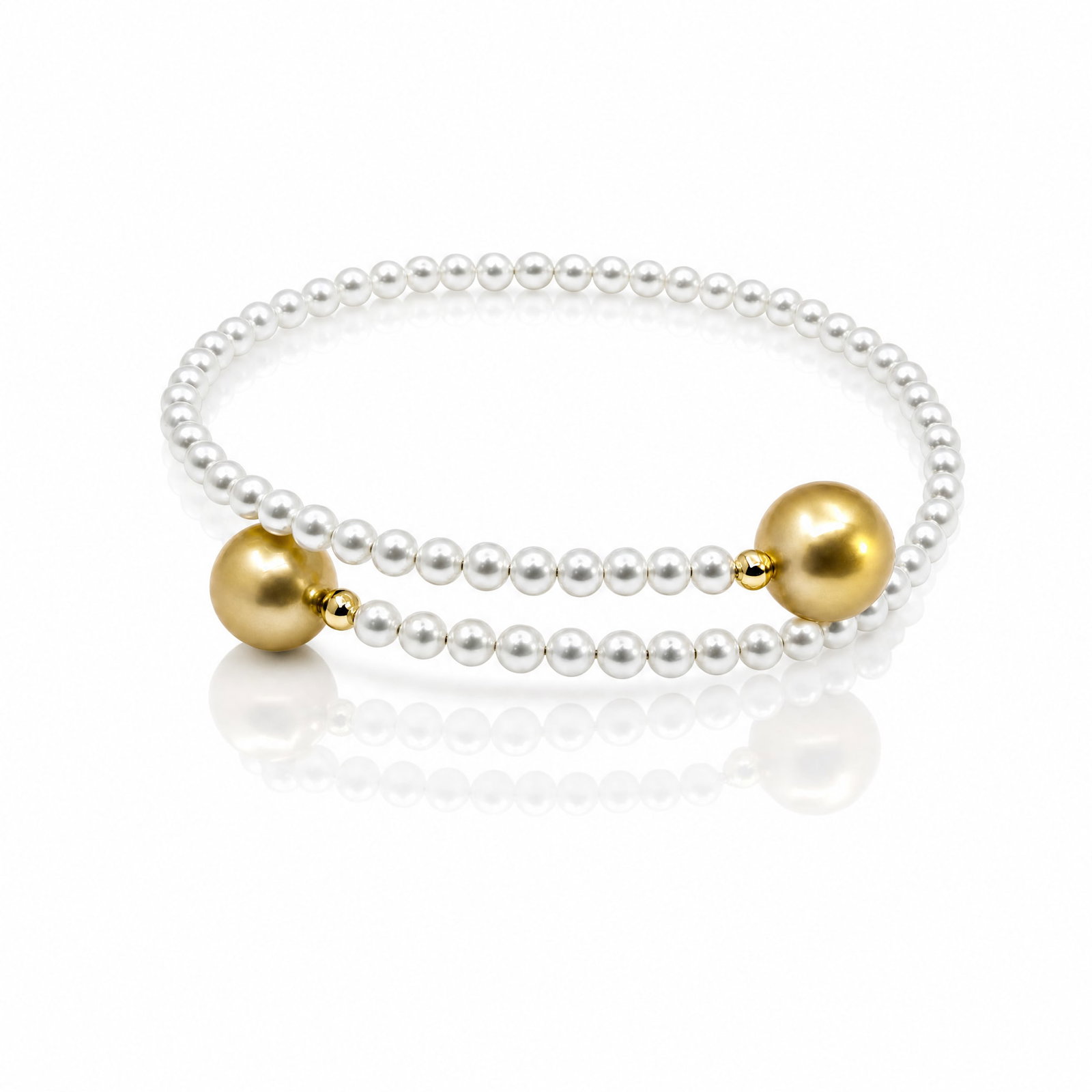 Golden South Sea Pearl and Freshwater Pearl Bracelet: ESTIMATED RETAIL PRICE: $1,900* *This is the estimated value a piece of similar quality, craftsmanship, and characteristics could command at retail. Designed as a flexible bypass coil, a strand of