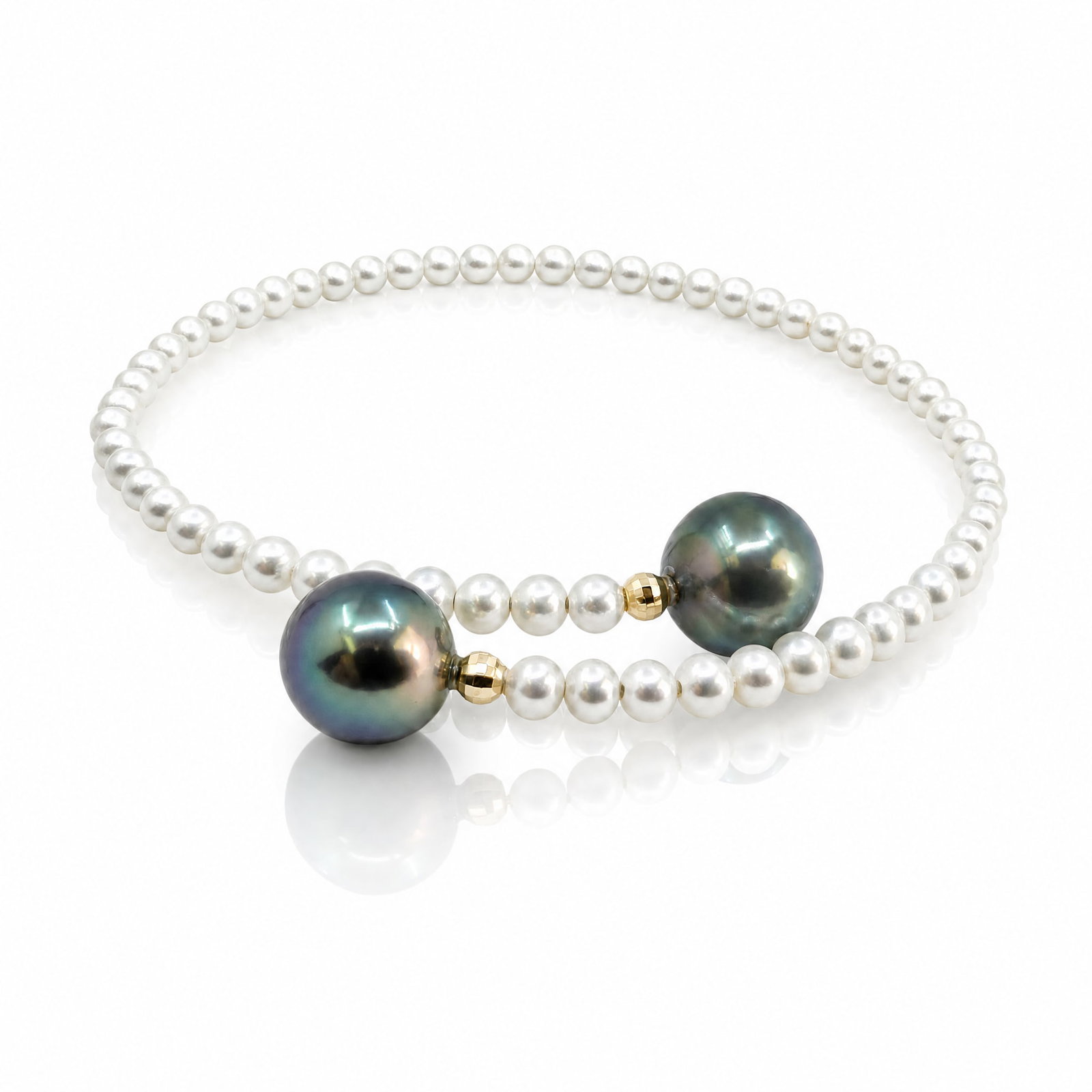 Peacock Tahitian Pearl and Freshwater Pearl Bracelet: ESTIMATED RETAIL PRICE: $1,100* *This is the estimated value a piece of similar quality, craftsmanship, and characteristics could command at retail. Designed as a flexible bypass coil, a strand of