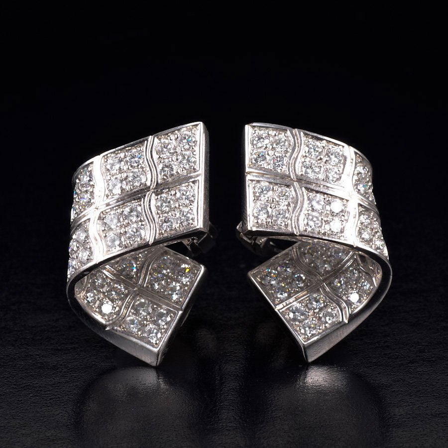 Piaget diamond ribbon shape earrings: approx. diamond weight=3.20 carats,Stamped Piaget B65374, 18k gold. measures approx. 0.98 x 0.66 in., weight 15.6 g