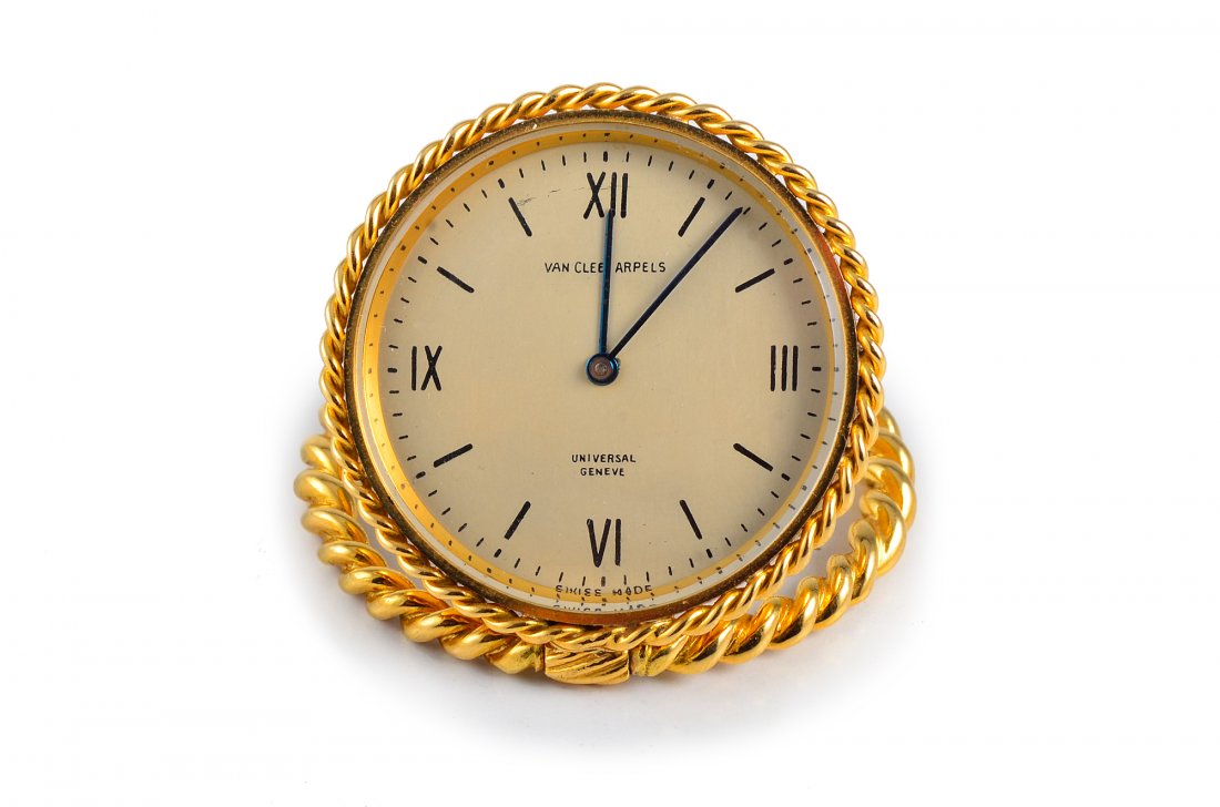 Van Cleef & Arpels Gold Travel Clock: VCA gold travel clock. Signed Van Cleef Arpels, Universal Geneve, Swiss Made, French Eagle metal stamp, To Bette Love Hylda May 24th 1958 78037, diameter measures 1 3/4", weight 58.5g