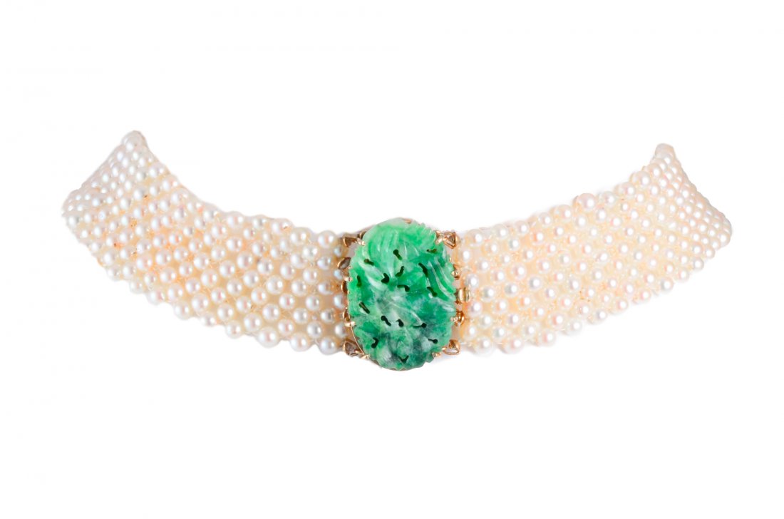 Woven Pearl and Jade Choker: Woven pearl and jade choker. 14K yellow gold. Center jade measures 27mm x 18mm x 3 mm. Pearls diameter 3mm. Length 13 2/8", width 3/4", weight 41.7g. Property from a New York estate.