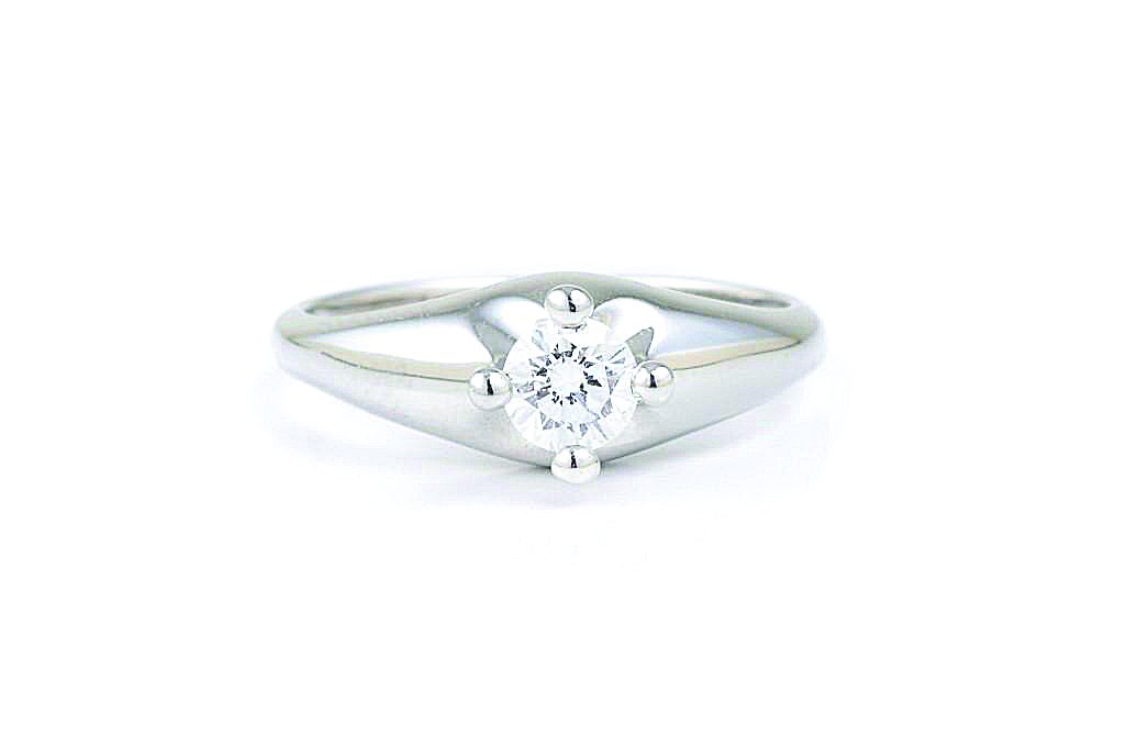 A Platinum Diamond Ring, by Bulgari: Set with a solitaire round brilliant-cut diamond, weighing approximately 0.30 carat; signed Bvlgari 36859; ring size 5; weight 5.6g.