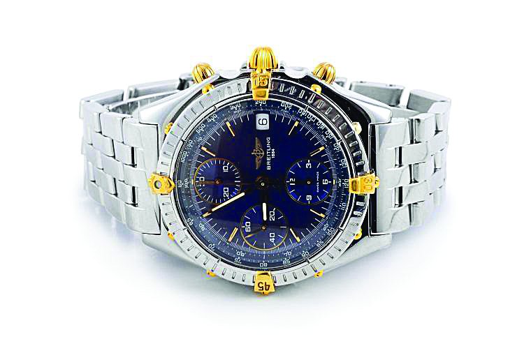 Breitling Stainless Steel and Gold Chronograph Watch: Features diagonal links and gold accents on the dial. Signed BREITLING 1884 STAINLESS STEEL SWISS MADE, Chronographe 100M B13050 103625. Inner circumference approx 6 inches. Weight 151g. In original b
