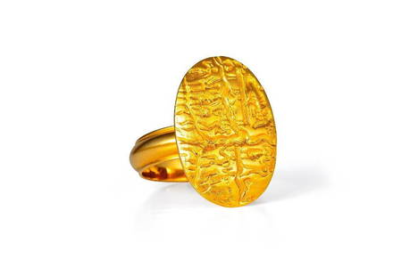 An Ilias Lalaounis Gold Ring: An Ilias Lalaounis Gold Ring. Crafted with 18k yellow gold, the ring features an oval top embellished with an engraved scene; ring size 7-3/4; weight 9.4g. Stamped 750 GREECE. Maker's mark, numbered