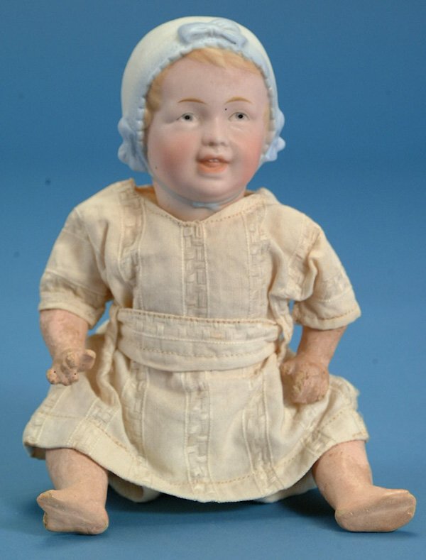 9" Recknagel Molded Bonnet Baby, marked 22-70, perf