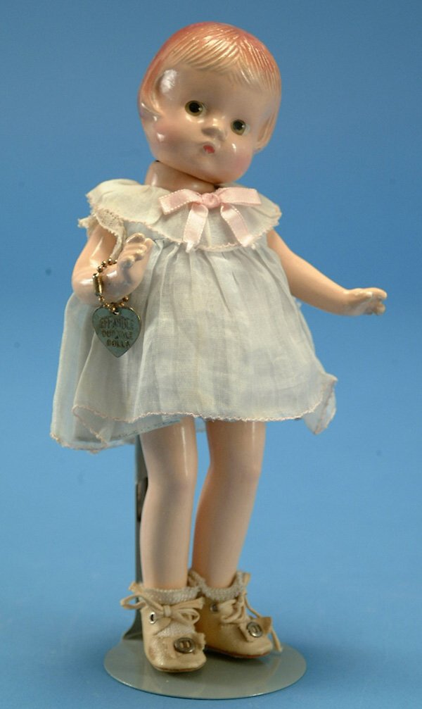 9" Effanbee Patsyette, all comp, molded hair, br.: 9" Effanbee Patsyette, all comp, molded hair, br. painted eyes, orig tagged costume w/bracelet, surface crazing, flaking on arms and hair, touchup on hair, G, (est. $100 - $200)