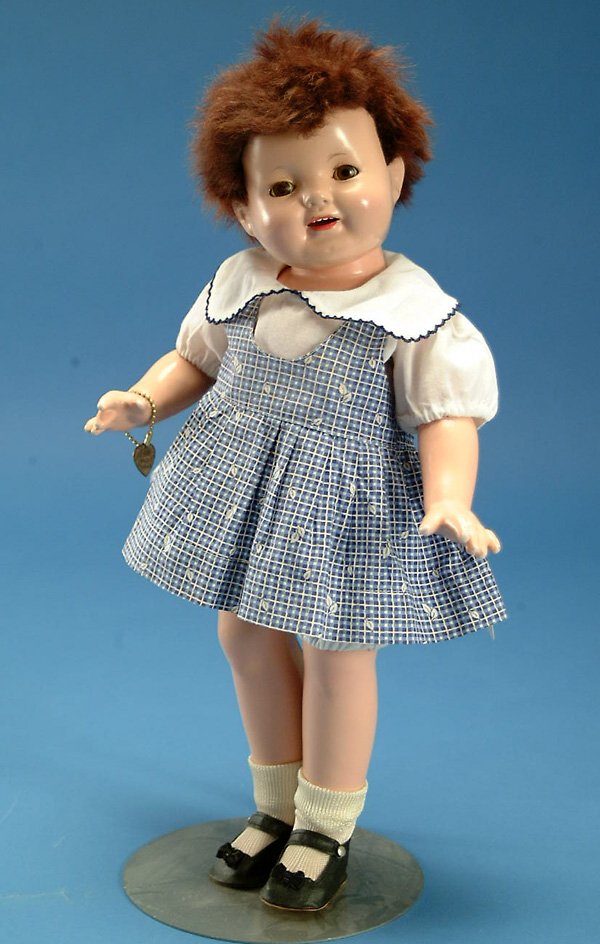 19" Effanbee Patsy Ann tousle head, all comp, br.: 19" Effanbee Patsy Ann tousle head, all comp, br. sl. eyes, replaced skin wig, o.m., orig tagged dress w/replaced blouse, orig bracelet, overall light crazing, flaking on body, VG, (est. $200 - $300)