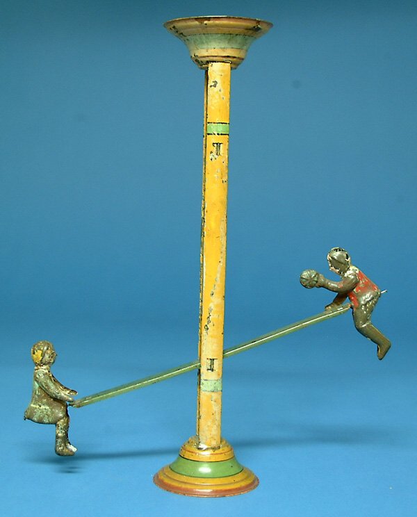 Gibbs See Saw Gravity Toy, painted tin, G, flaking: Gibbs See Saw Gravity Toy, painted tin, G, flaking to figures, (est. $100 - $200)