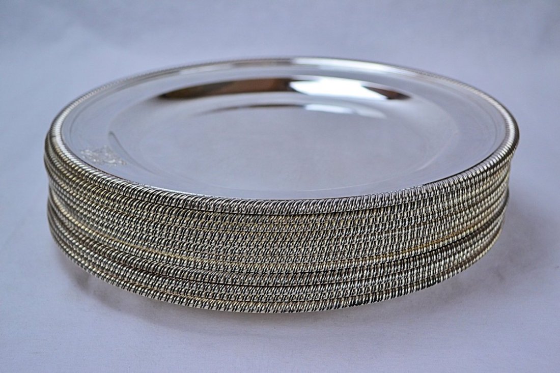 Robert Sharp English George III Sterling Plates (12): This is a set of twelve English George iii sterling silver plates, made in London by silversmith Robert Sharp in 1801. The plates are decorated with a gadroon border and each have an English bright cu