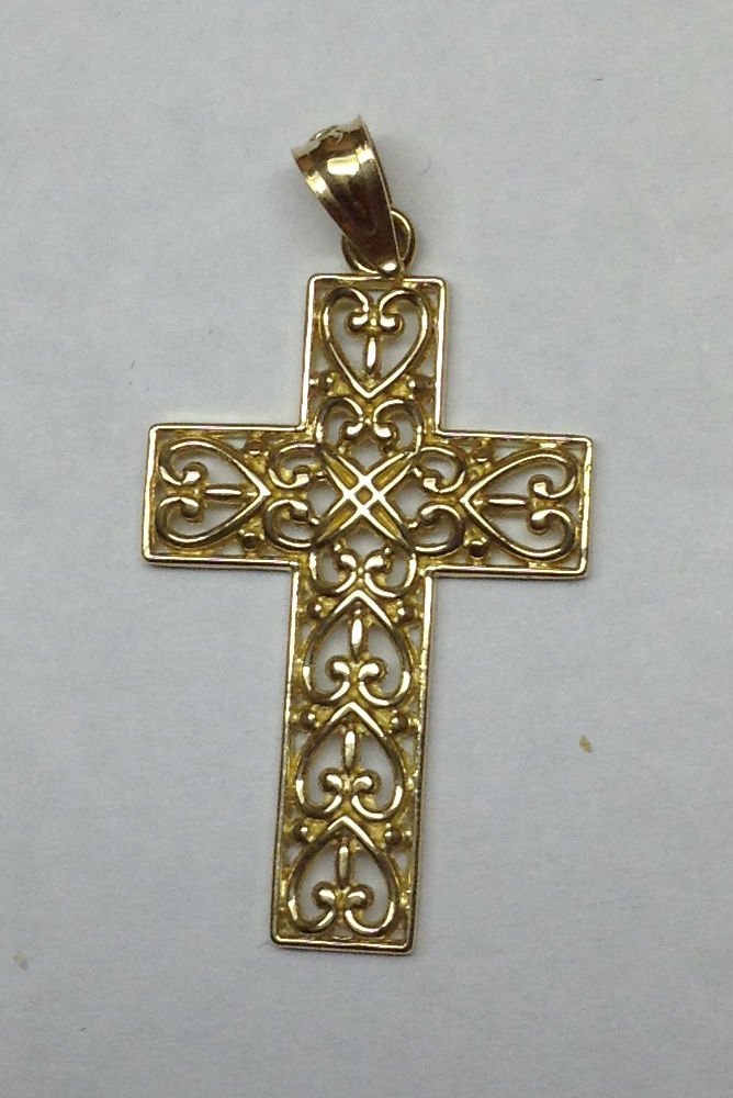 14 K gold cross: 14 K gold cross 1.1 grams. Start price is the melt value!