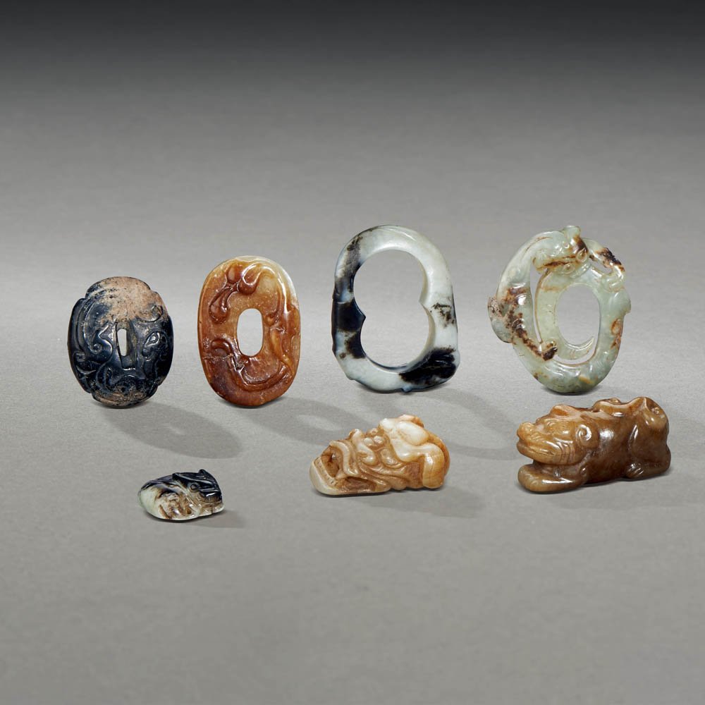 A GROUP OF SEVEN CHINESE JADE CARVINGS: MING DYNASTY (1368-1644) A GROUP OF SEVEN CHINESE JADE CARVINGS 明 玉器一組7件 The largest: L 6 cm. (2 3/8 in.)