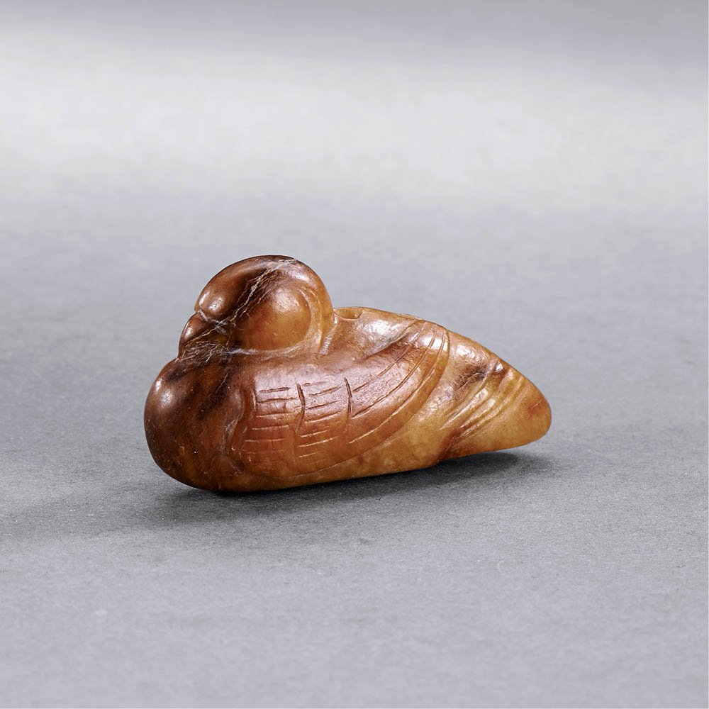 A CHINESE YELLOW AND RUSSET JADE MAGPIE PENDANT (1 of 5)