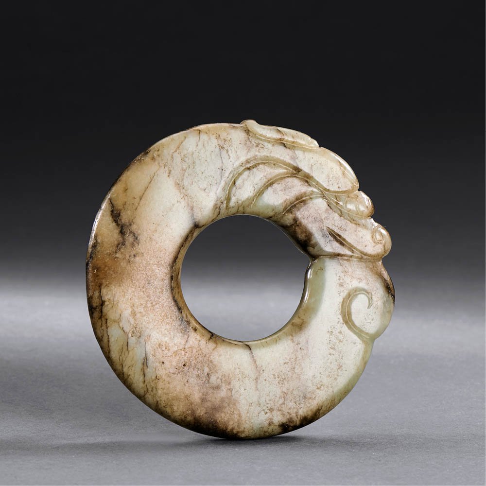 A CHINESE WHITE AND RUSSET JADE DRAGON DISC, HUAN (1 of 2)