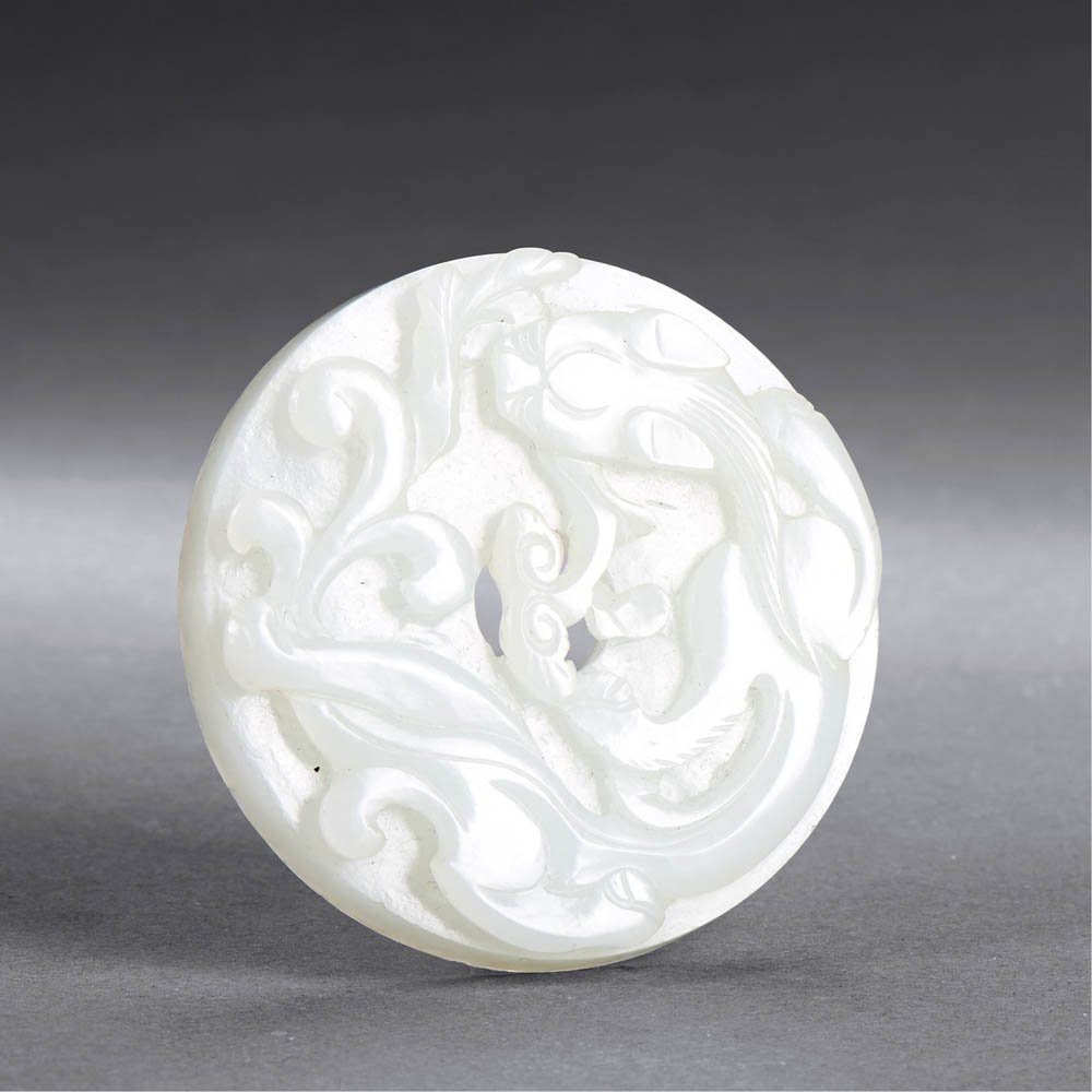 A CHINESE WHITE JADE CHI DRAGON DISC, BI (1 of 2)
