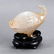 AN AGATE CASE CARVED WITH A IVORY TUSK BOAT
