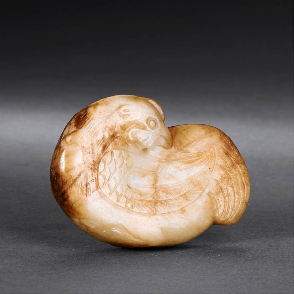 A CHINESE WHITE AND RUSSET JADE CHICKEN PENDANT (1 of 2)