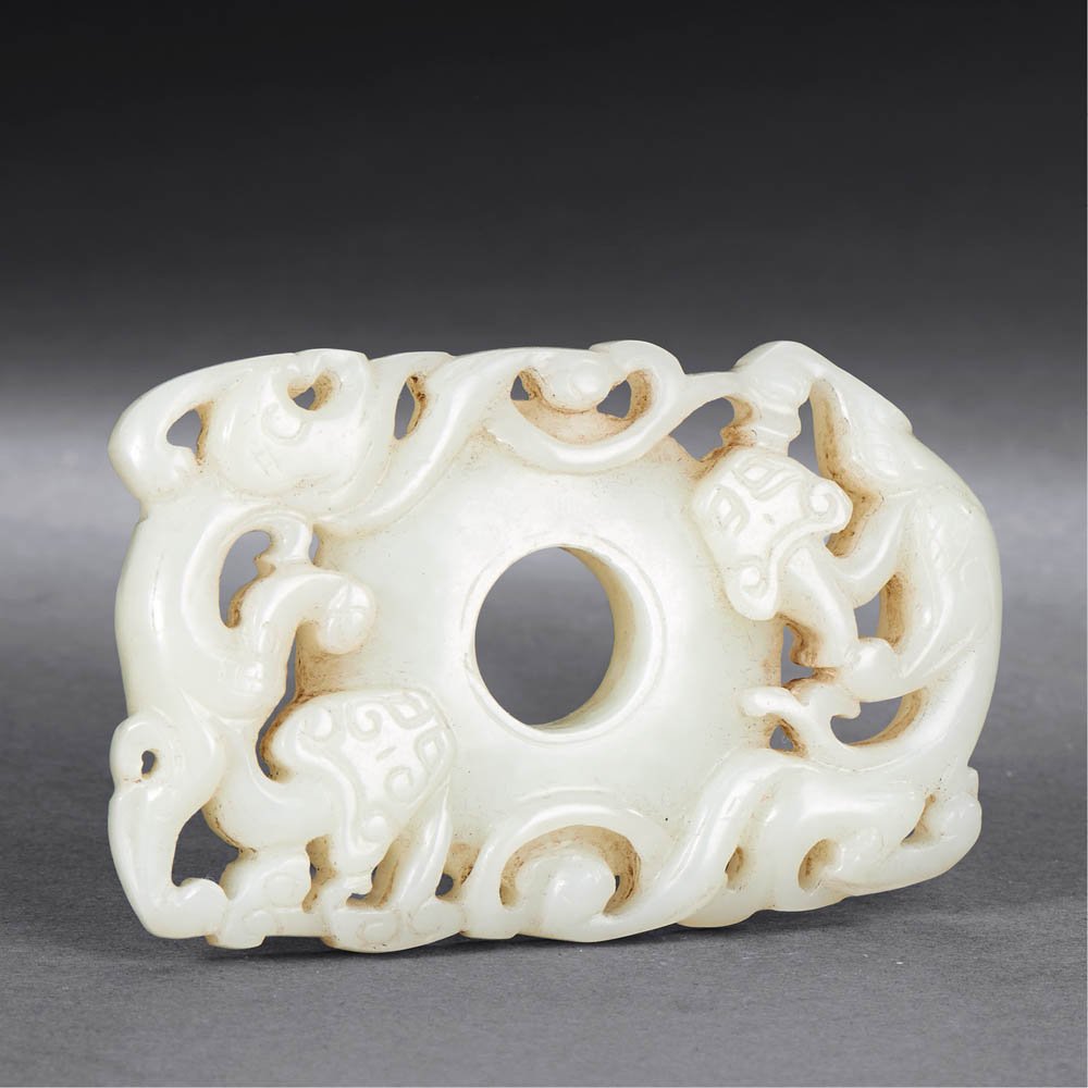 A CHINESE WHITE JADE TWO-CHI DRAGON DISC, BI (1 of 2)