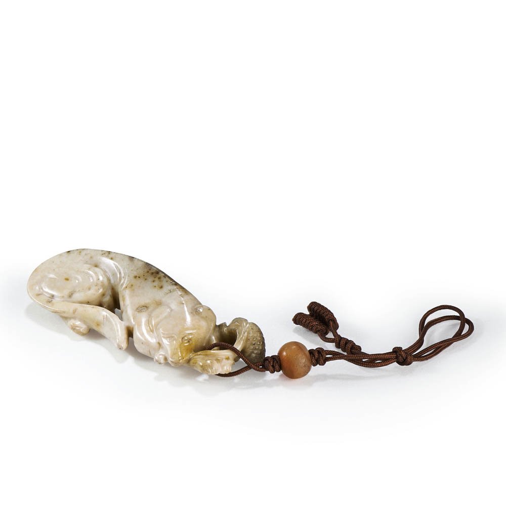 A CHINESE WHITE AND RUSSET JADE RECUMBENT DOG (1 of 4)