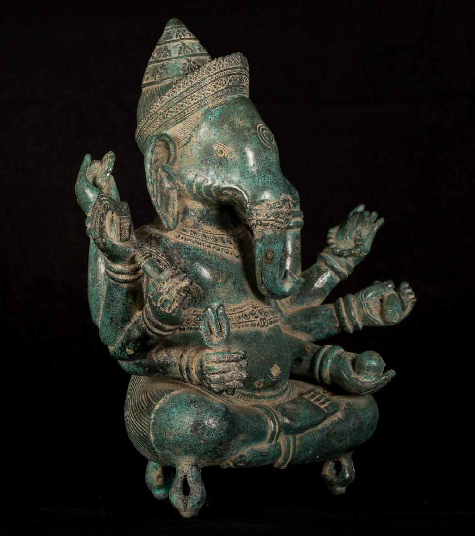 19th Century Seated 8 Arm Ganesha: Ca. 19th century antique bronze seated 8 arm Ganesha. In his hands a variety of objects, including a noose, elephant goad, mango and his broken tusk. Ganesha is the elephant headed son of Shiva. He ho