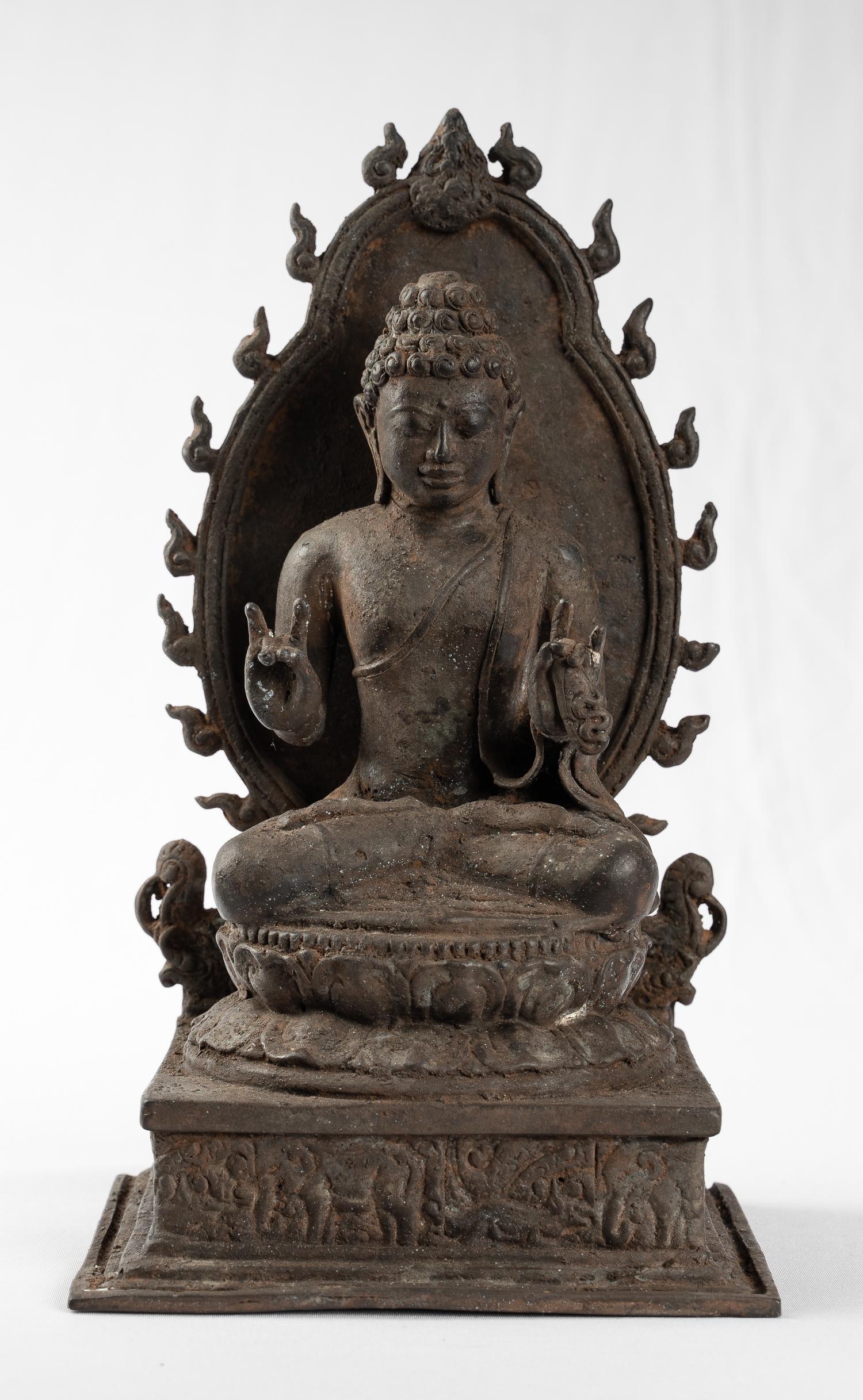 Antique Indonesian Style Bronze Javanese Vairochana: An Indonesian (Java) Vairochana Buddha in 13th century Majapahit style. Â This splendid Buddha is seated on a large double-lotus pedestal, itself on a squareÂ pedestalÂ in the cross-legged yogi