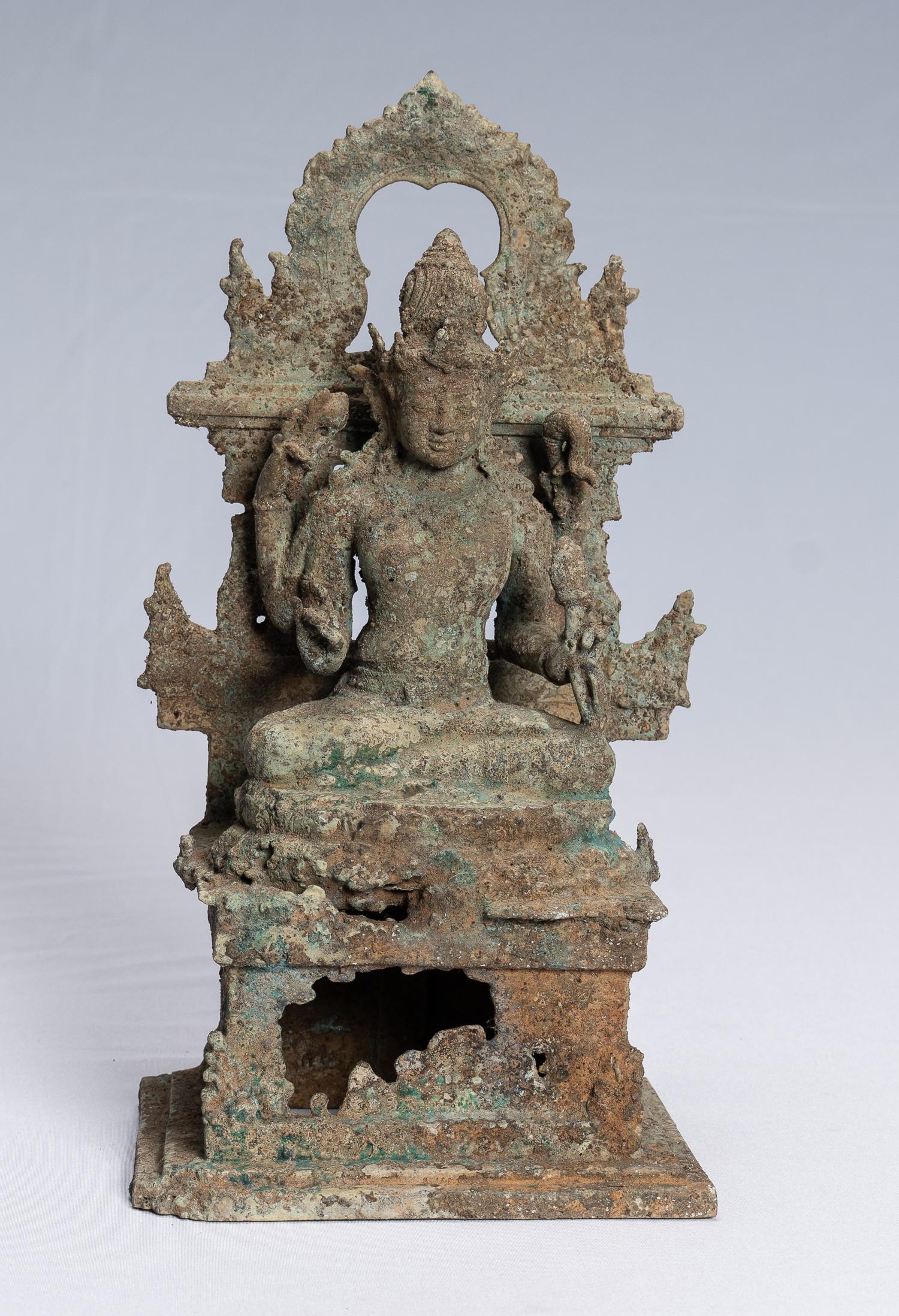 Antique Indonesian Style Majapahit Enthroned Bronze: An antique Java Style seated bronze Vishnu sculpture in the 13th century Majapahit style.Vishnu is both world protector and preserver, restorer of moral order - he is all-powerful and all-pervasive by