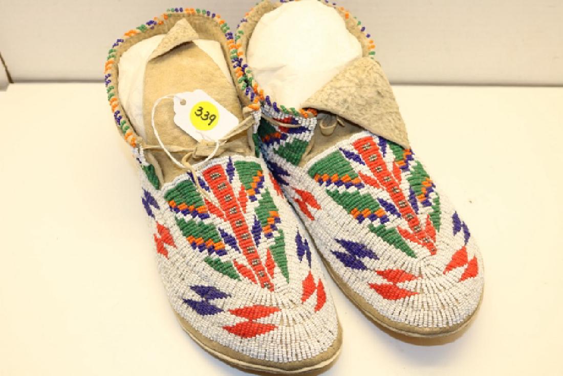 beaded moccasins: 10 ½” beaded moccasins, rawhide soles, intricate bead designs, very good condition