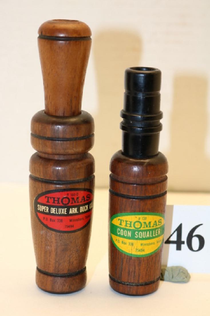 Lot of two Thomas (Winnsboro, TX) game calls: Lot of two Thomas (Winnsboro, TX) game calls: 1) No. 160-D duck call w/near perfect applied paper label. Call measures 5 1/2" with walnut stopper and barrel. A single plastic reed provides wonderful t