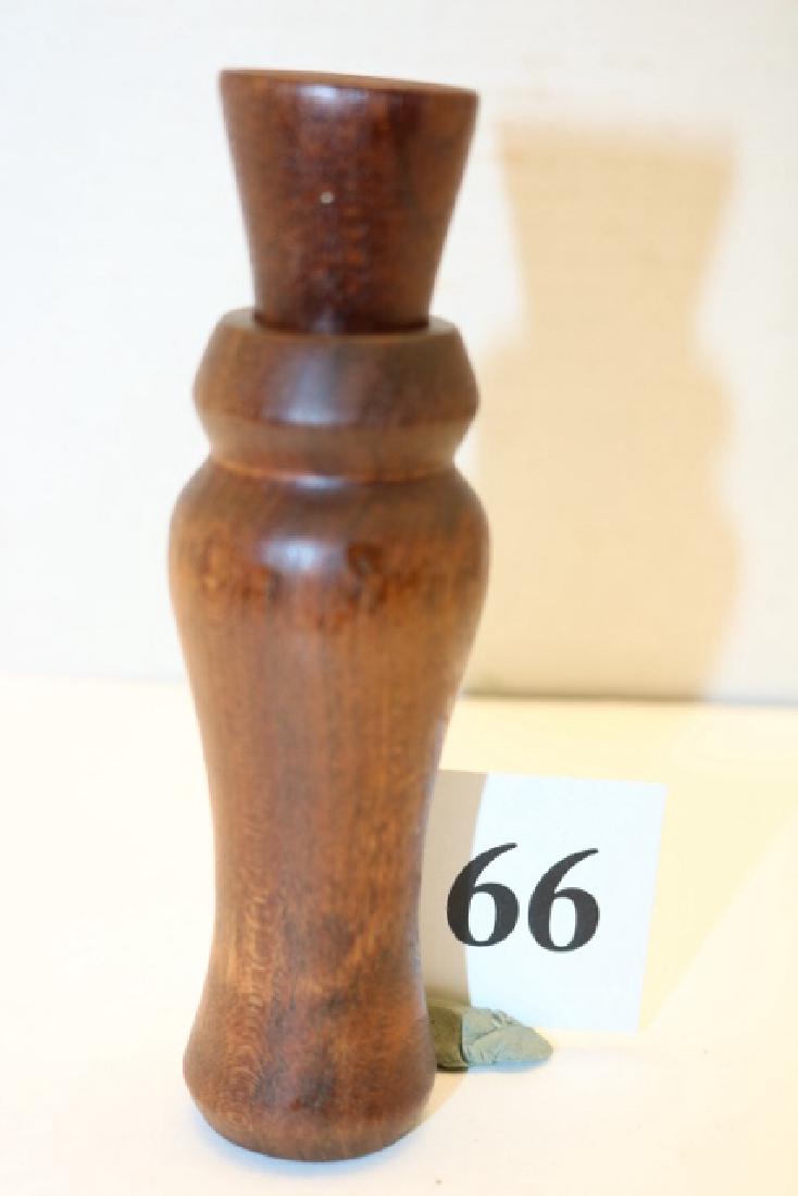 cedar barrel, walnut stopper duck call: Outstanding cedar barrel, walnut stopper duck call by unknown maker featuring a metal reed, wood tone board and wedge. This call appears to have never been used showing no scuffs/dings etc. The call m