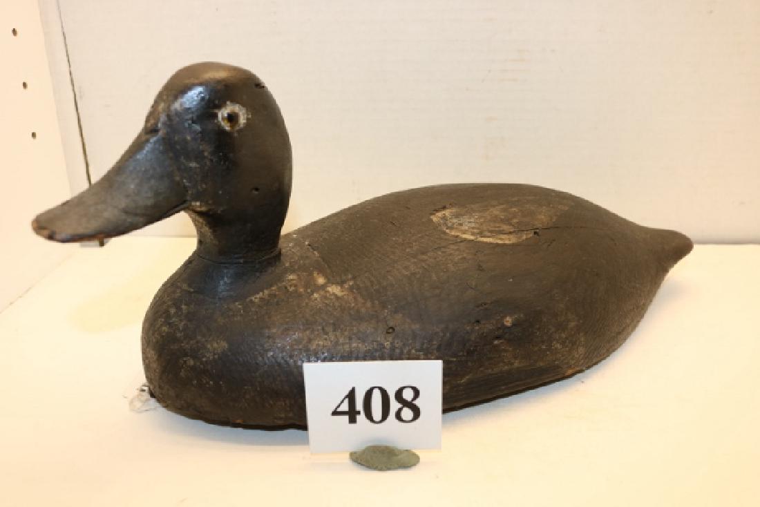 Golden Eye Drake: Very old Golden Eye Drake from New England region, maker is unknown. Very solid bird with weights removed, old leather tie eye is intact. The working decoy shows scattered repaint with much of the ori