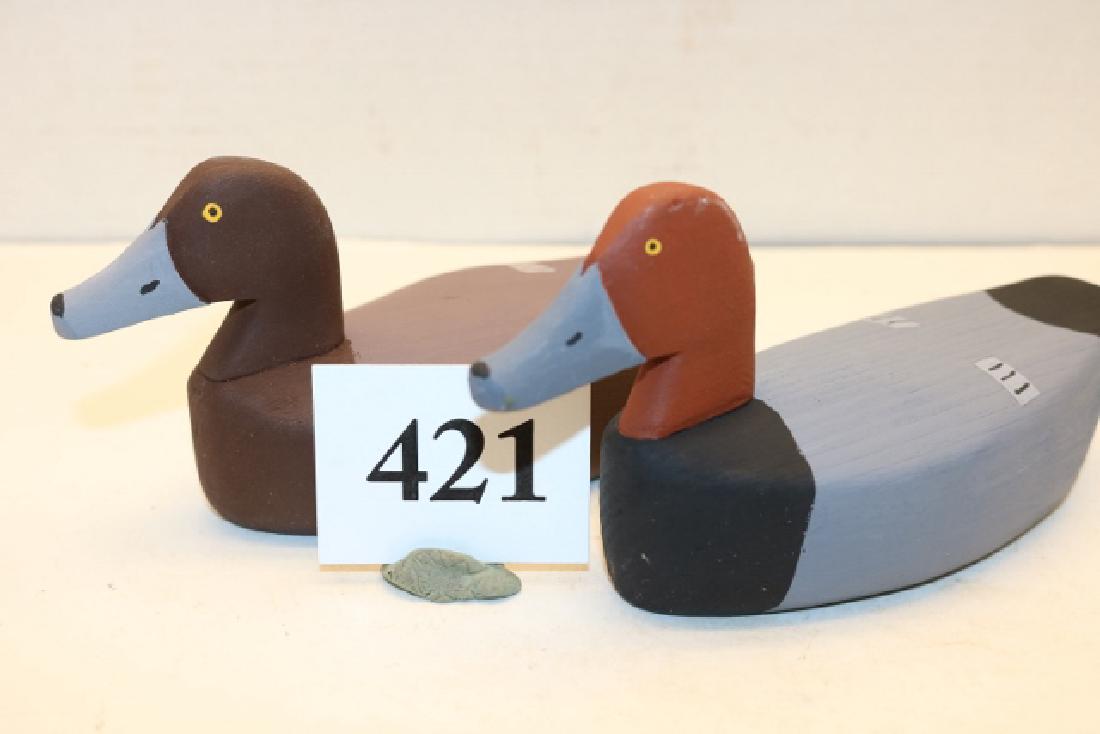 Pair of miniature Red Heads (1 of 2)