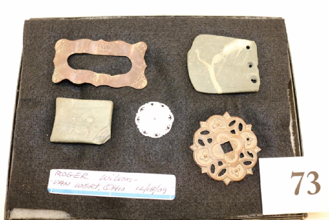 salvaged Slate Gorget: 8" x 6" Frame containing Five Items found by Roger Wilson in Van Wert including a salvaged Slate Gorget with worm, Miniature Quad Gorget with starter holes, carved shell button and two pieces furnitur