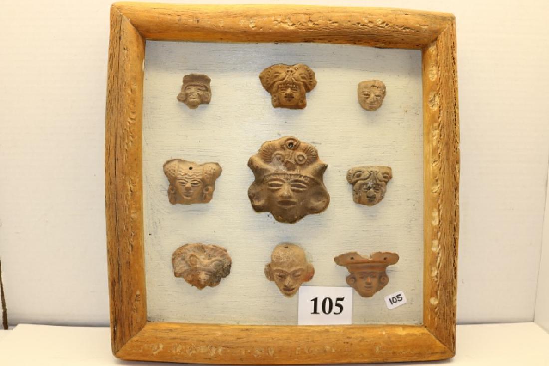 9 Pottery Mayan Heads: 12 x 12 Frame with 9 Pottery Mayan Heads – largest 2 1/2" x 3"