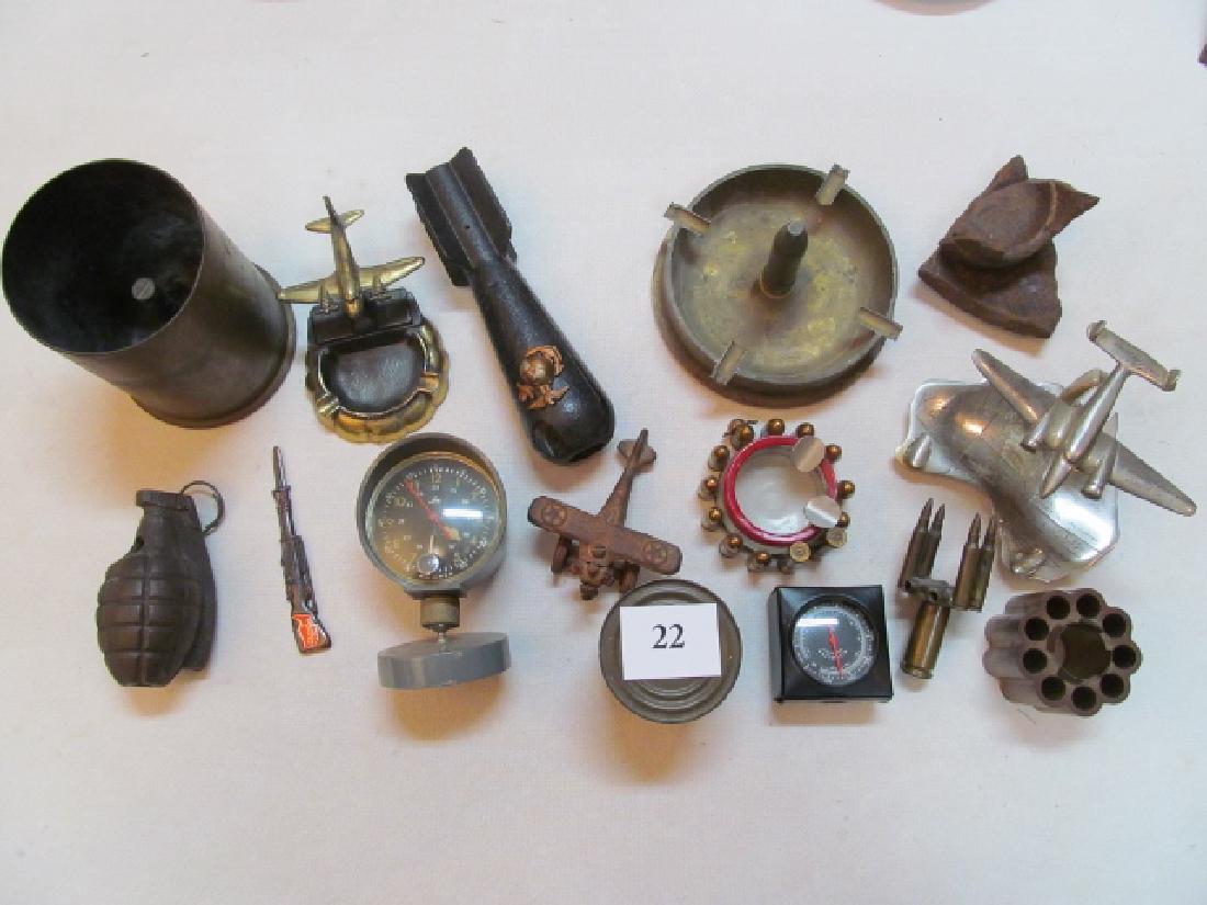 5 Trench Art Ashtrays: 5 Trench Art Ashtrays, 2 with airplanes, 1 embossed with Australia, Philippines & South Pacific Air Fields, also a Practice Grenade, a Demilled Morter with USN Insignia, K Rations, an Airplane Firing