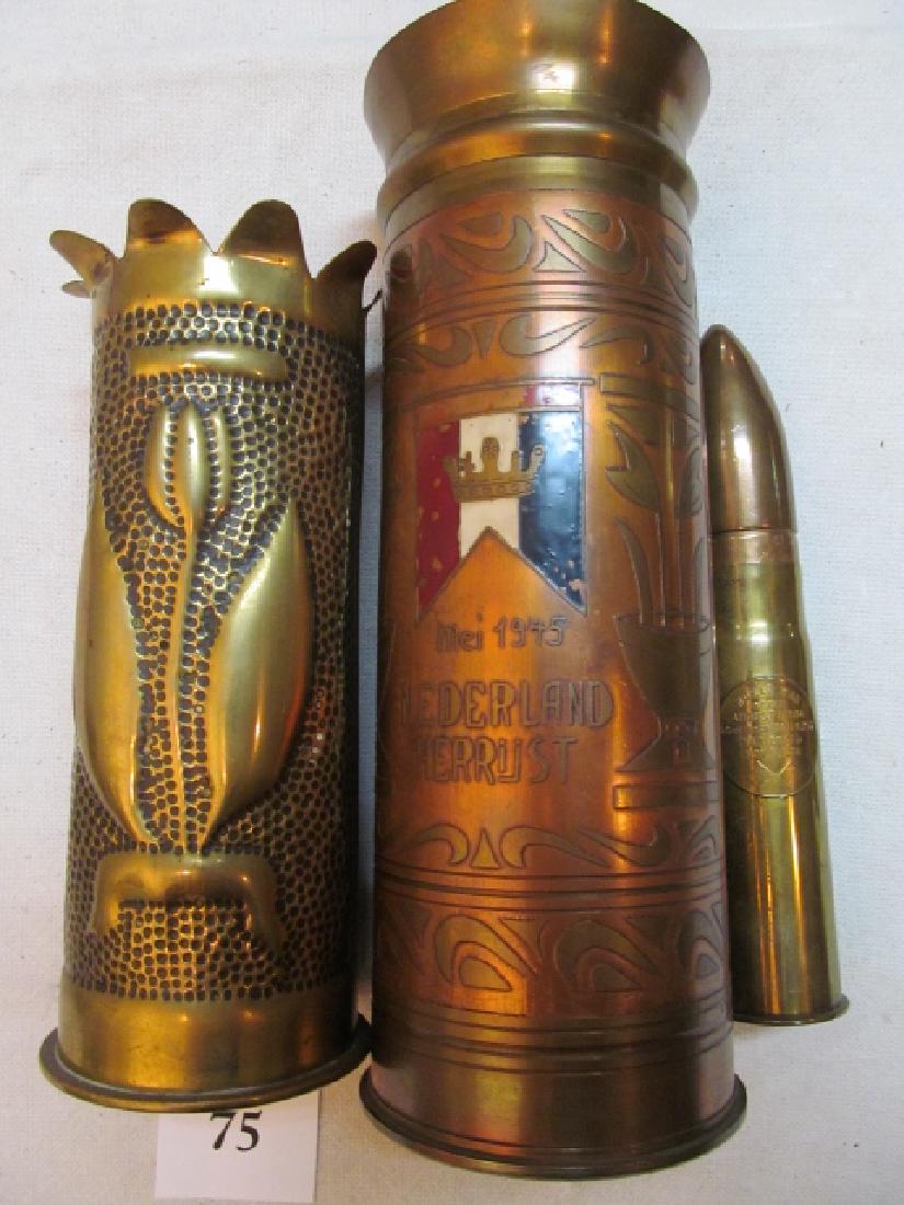 3 Pieces of Trench Art: 3 Pieces of Trench Art: WWI with tulip design front & scallop top, 9” tall and a WWII Nederland Herrijst, star on bark, floral pattern, flag & crown on center of front 11 ¼” tall and 