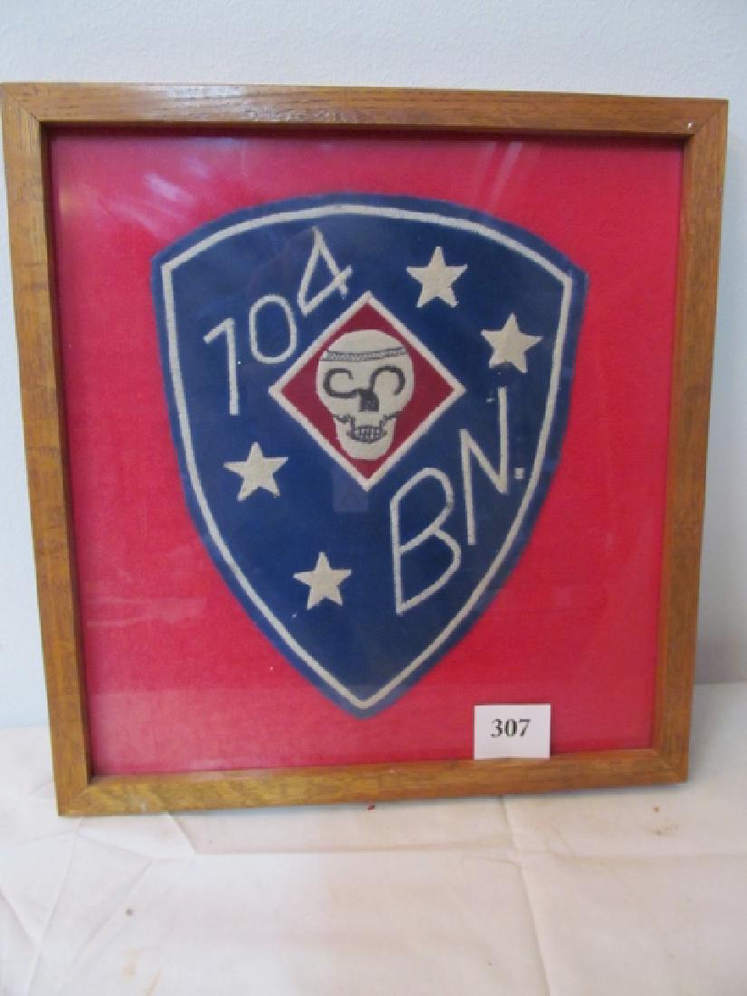 Large Framed Cloth USMC Military Insignia: Large Framed Cloth USMC Military Insignia has Marine Raider Insignia 13” x 10 ½” features Skull, 4 stars & 704 BN (Jacket Patch)