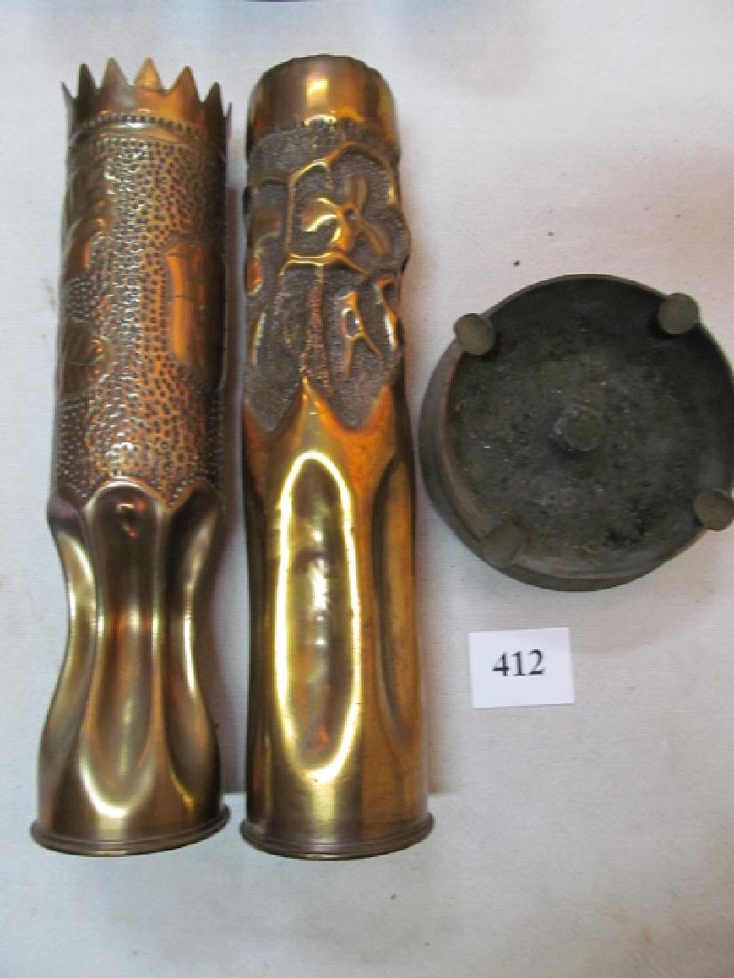 3 Pieces of Trench Art: 3 Pieces of Trench Art: 75mm Argohne 1918, 13 ½” tall, a WW AEF 1918 embossed shield & leaf pattern, 13 ½” tall and a WWII 5” MK Ashtray