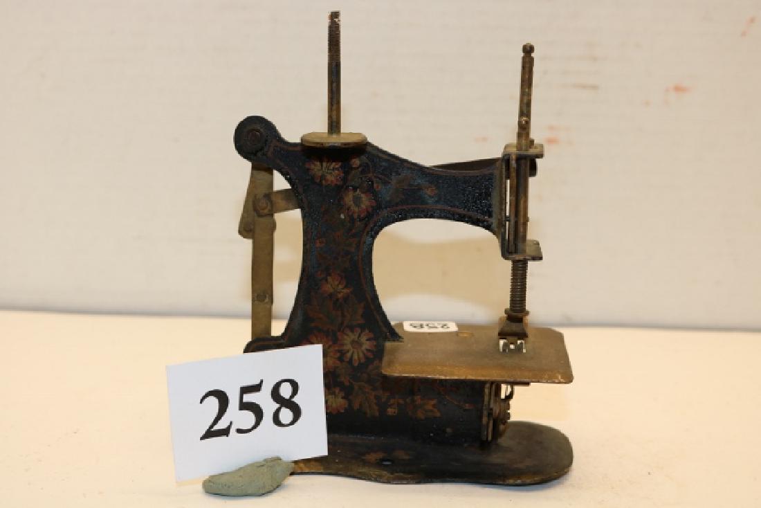 Painted Childs Sewing Machine: 4 ½” x 6 ¼” Ornately Painted Childs Sewing Machine, circa 1860
