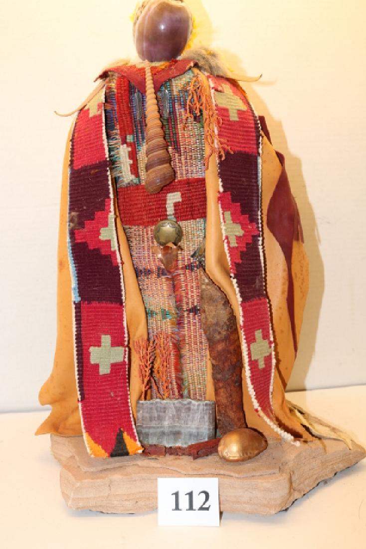 Doll on stone base: 16” Doll on stone base, shell decorated hide, beads – no shipping out of country