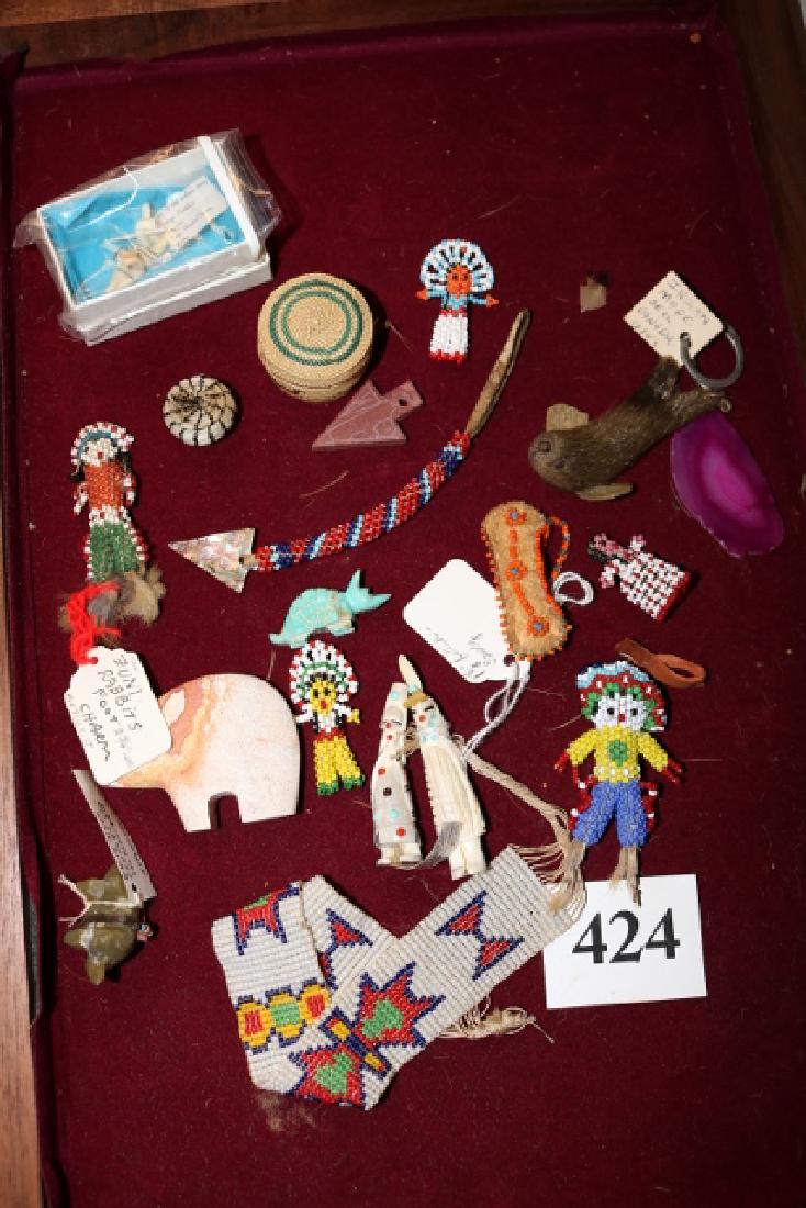 5 Beaded Miniature Dolls: 12” x 18” Display Box with 5 Beaded Miniature Dolls, Beaded Arm Band, Mini Circular Lidded North West Coast Basket, Mini Canoe, 2 Bone Figures, Arrow Fetish, Sealskin Seal, Carved Bone Fet