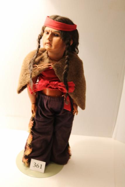 Male Porcelain Head Indian Doll: Male Porcelain Head Indian Doll – 1890’s – Open Mouth, Brown Glass Eyes, Composition Body Jointed, All Original – With Stand – 20” Tall