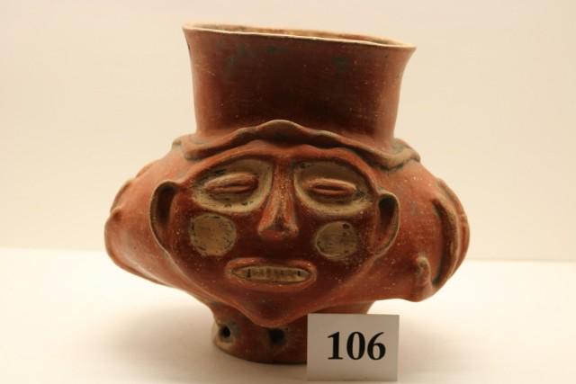 Red & White painted Pottery Vessel: Red & White painted Pottery Vessel w/ high relief face front and back, relief hands on each side, base broken & glued – cracked