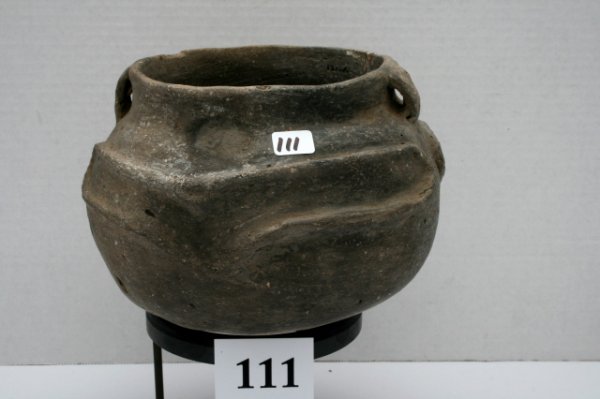 Pot with Frog Effigy: 7 1/2" x 5 3/8" Pot with Frog Effigy both sides and two strap handles found 1931 on the C.M. Bell Place Miss. Co. Ark. has three restored probe hole and a crack filled in with restoration material