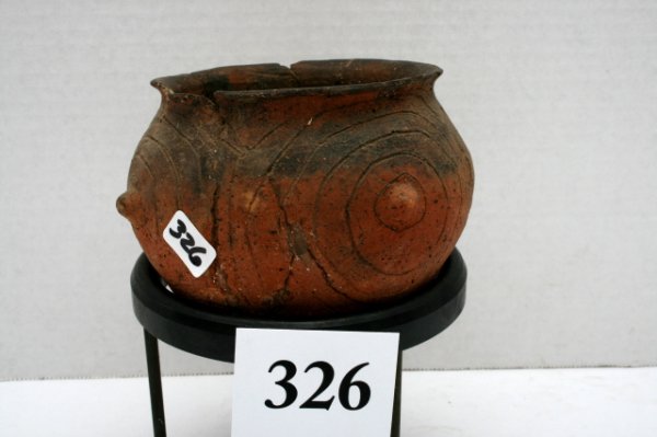 Red-Brown Bowl: 5" x 3 1/2" Red-Brown Bowl with Flaired Rim Four Knobs with concentric circles around them found 1927 by S.D. Dickinson and Bert King at the Tom Collier Place Montgomery Co. Ark. - broken and glued