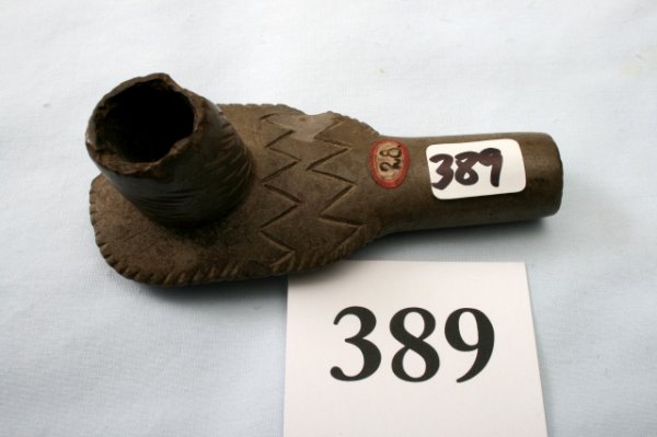 3 7/8" Pipestone Pipe: 3 7/8" Pipestone Pipe with scalloped edge and engraved designs top and bottom, chips to bowl and edges of pipe, hole in bottom where bowl worn through, North Ohio near Lake Erie