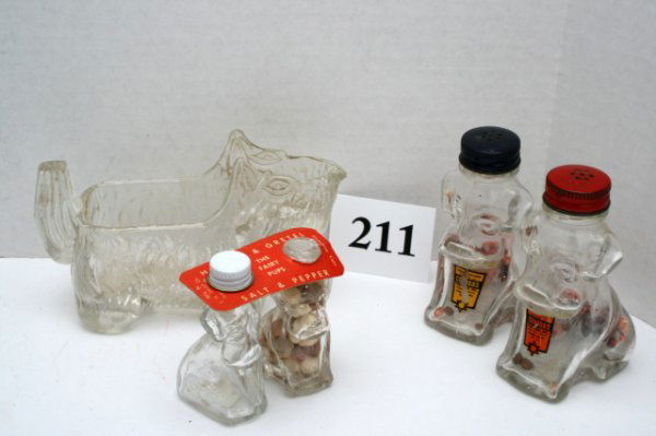 4 Dog Candy Containers: n/pic - (4pcs)Dog - "Hansel and Gretel" - (2)Fairy Pups - One dog has embossed sides with screw top - one dog plain sides with ringed top - has cardboard replaced collar Dog - "Spoon Holder" - N/C Dog